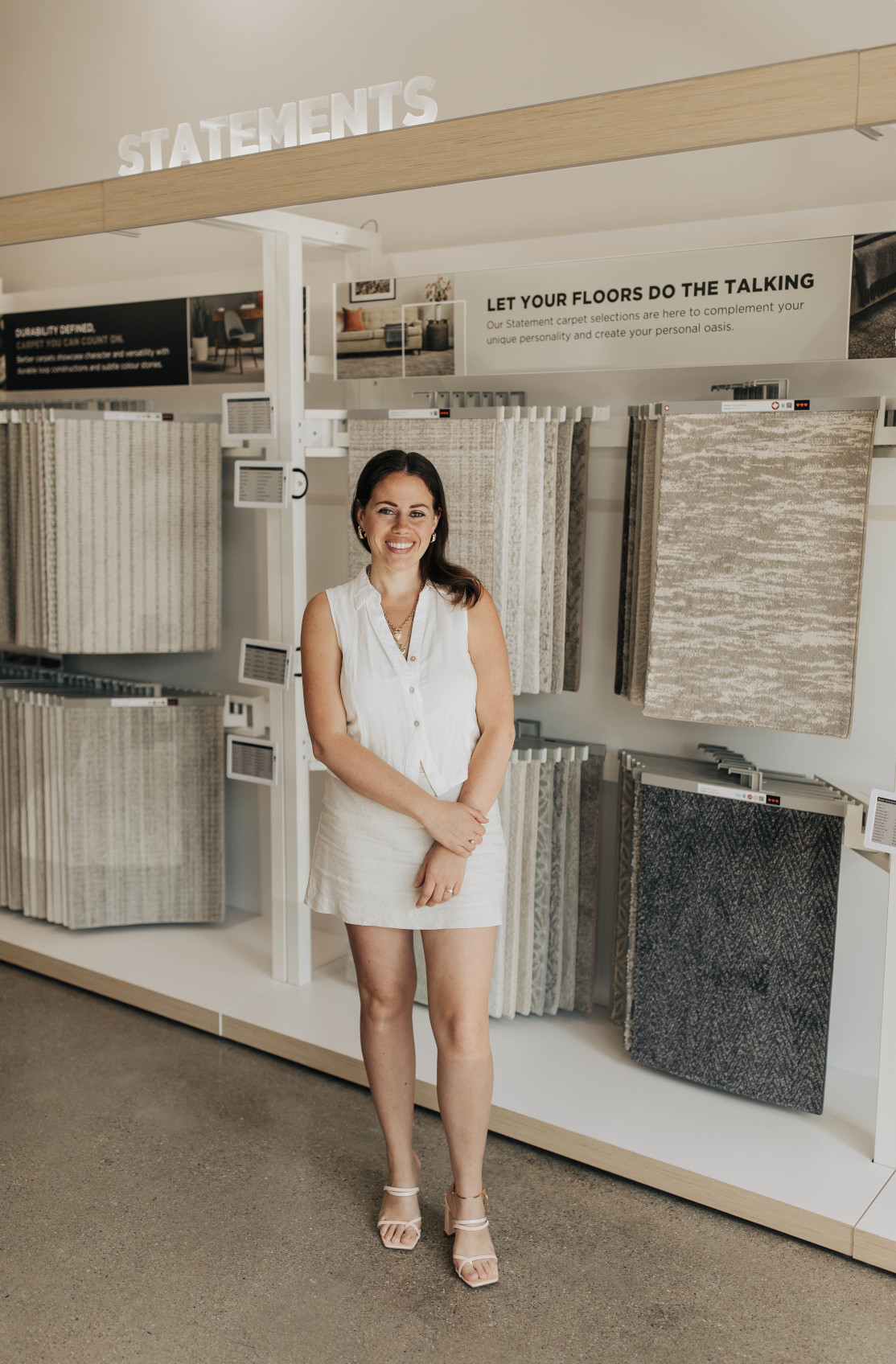 Women holding flooring sample in floor store 