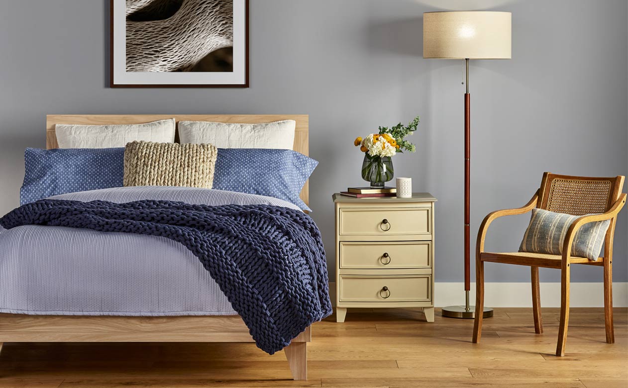 Bedroom with new oak hardwood flooring from Flooring Canada