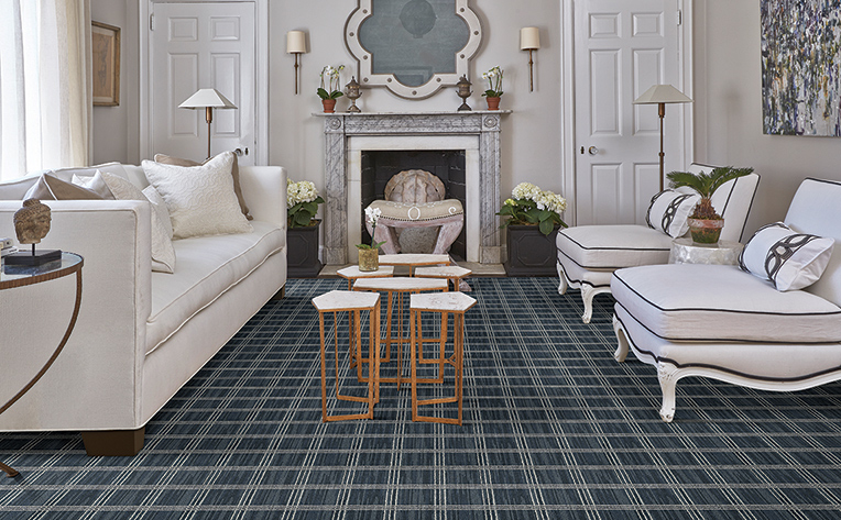 Formal living room with white furniture with blue and white carpeted floors